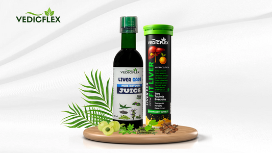 VedicFlex liver care products including a bottle of Liver Care Pure Natural Juice and a tube of Fit Liver effervescent tablets, displayed on a wooden tray with green leaves, amla fruit, and herbal ingredients